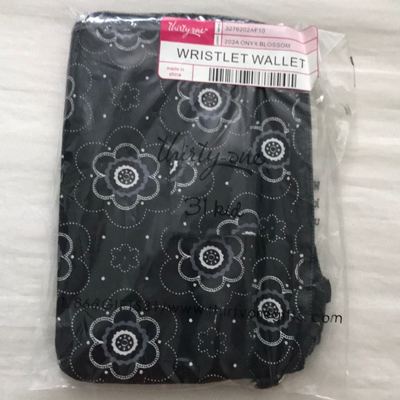 Wristlet wallet in Onyx Blossom. - Picture 1 of 3